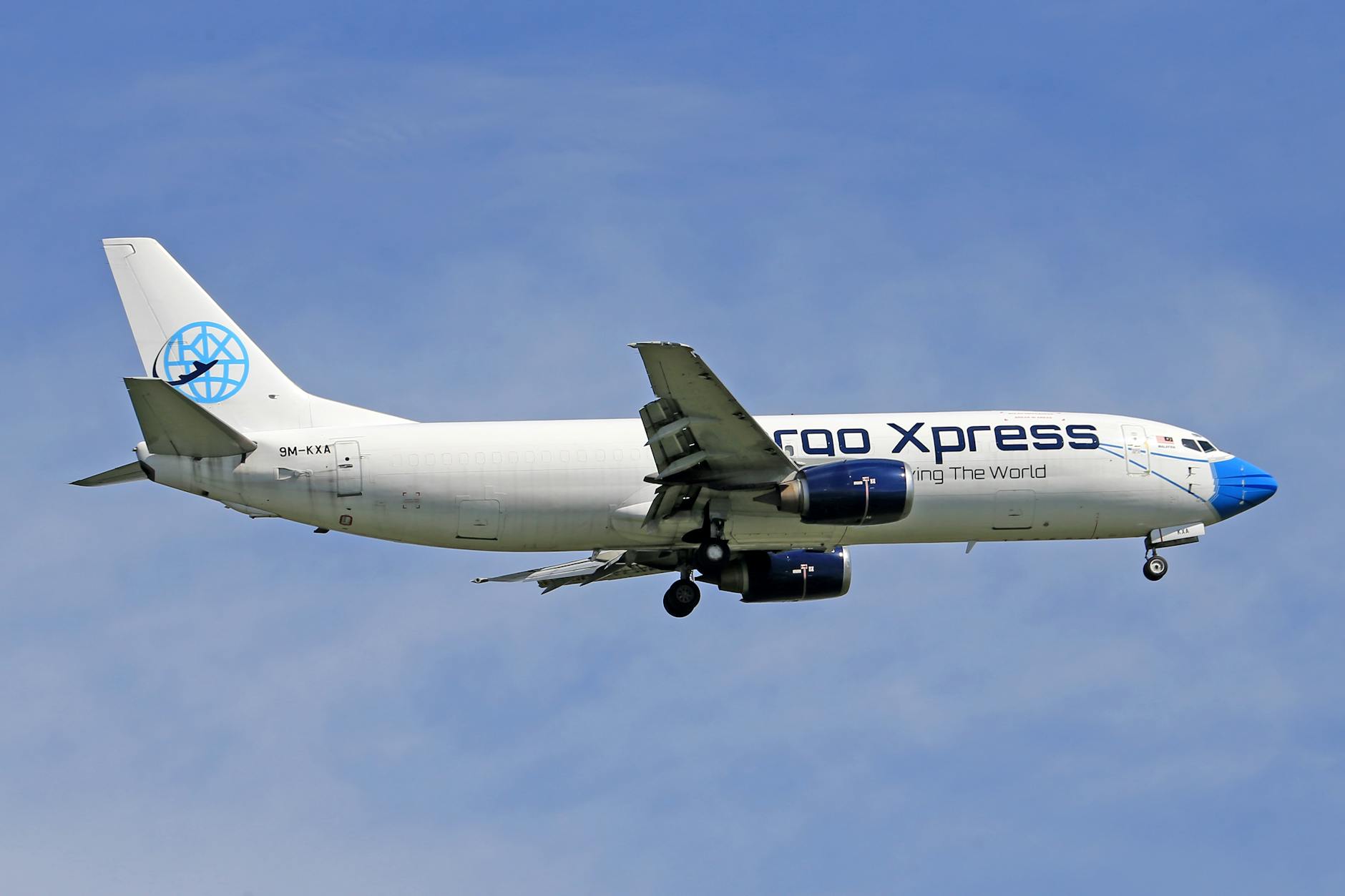 Cargo airplane flying against clear sky - air freight rates rising in April 2026 what shippers need to know