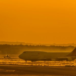 Boeing 747 freighter aircraft on runway at sunset - new air cargo routes and services launched spring 2026