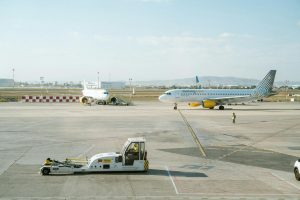 Airplane taxiing on airport runway — Norwegian Air Shuttle cargo alternatives