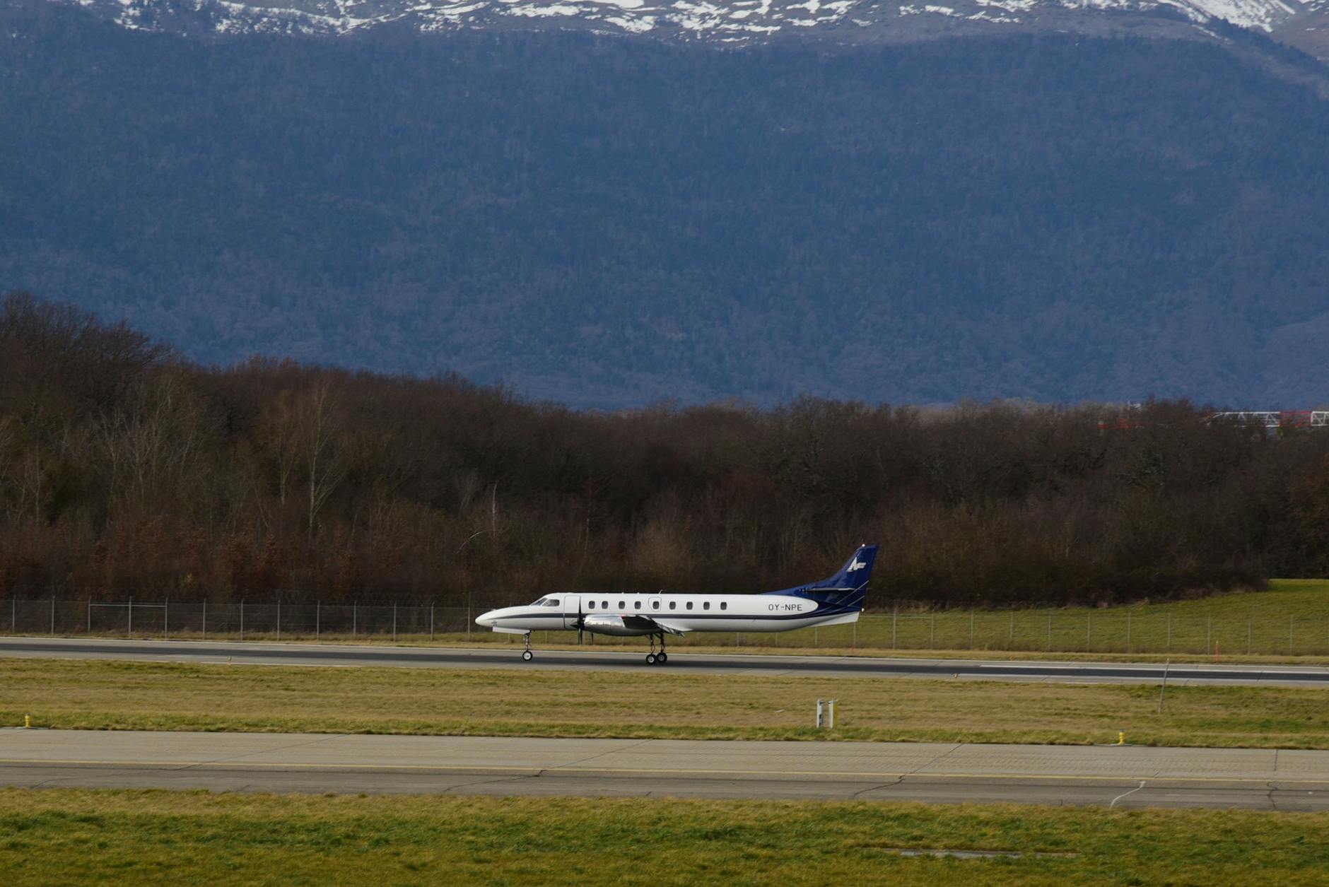 Passenger plane at airport with mountains — Emirates SkyCargo air freight