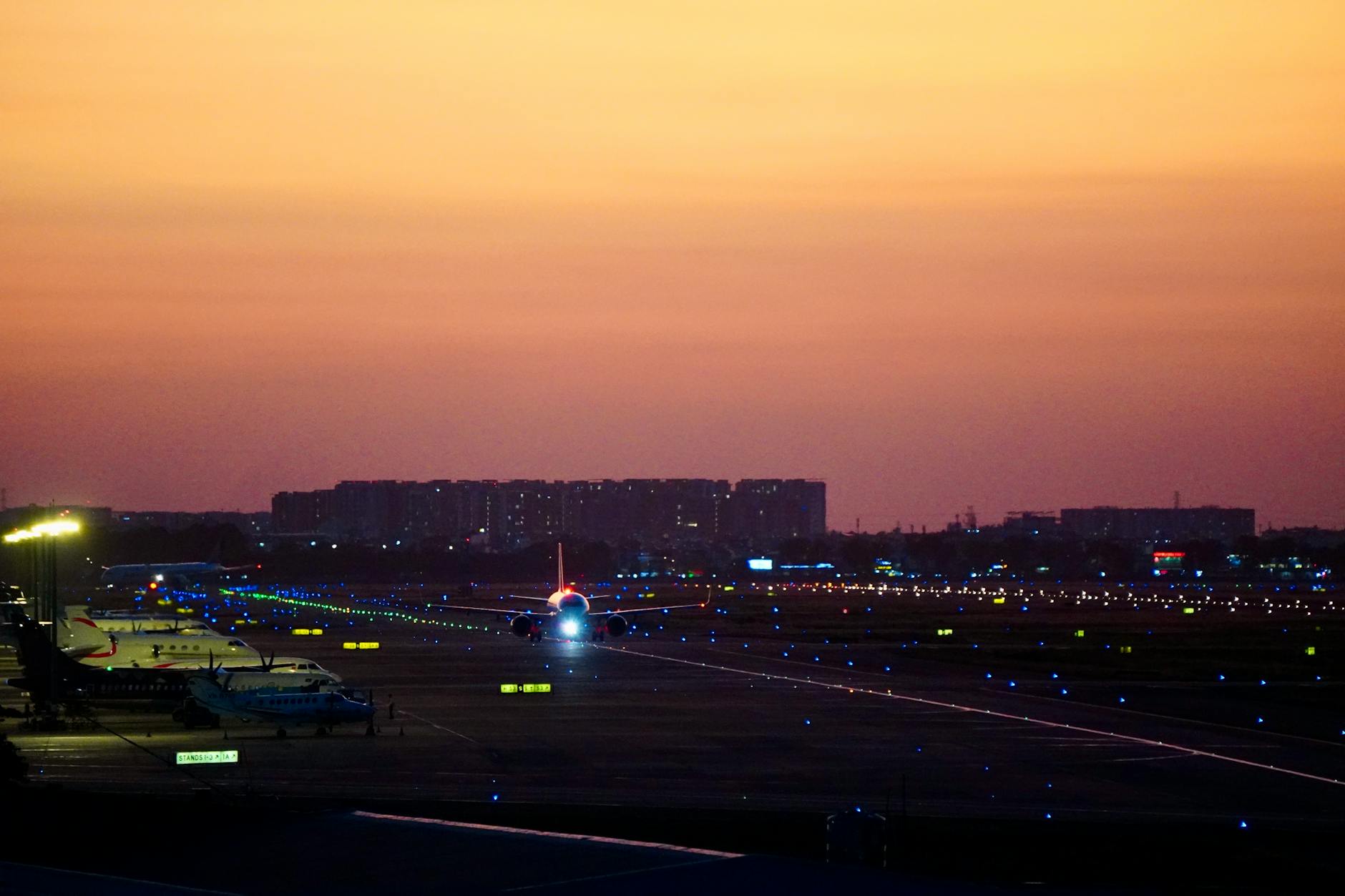 Airplane on illuminated runway at sunset — UPS Airlines air freight cargo