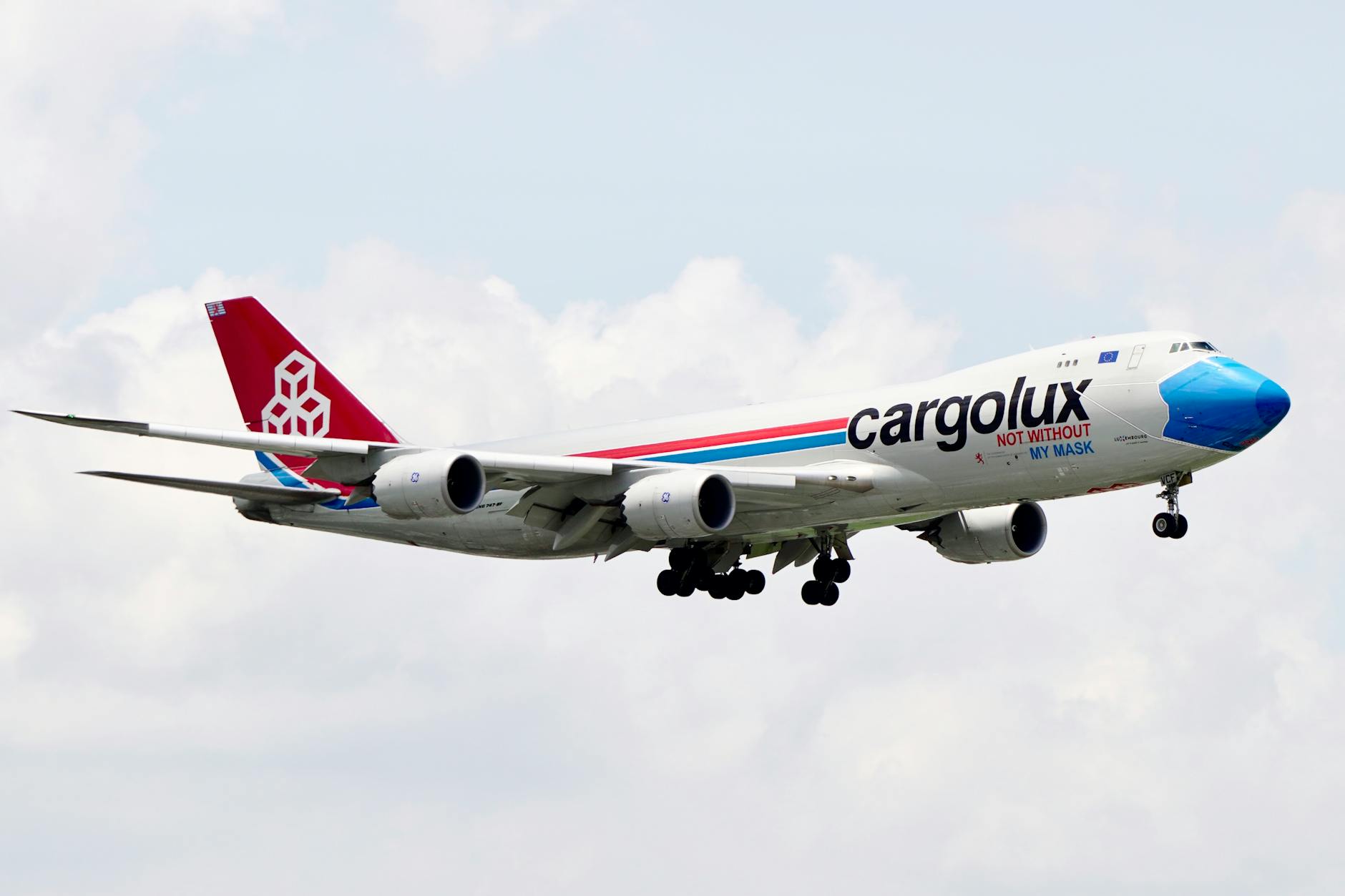Cargolux Boeing 747 freighter flying against blue sky