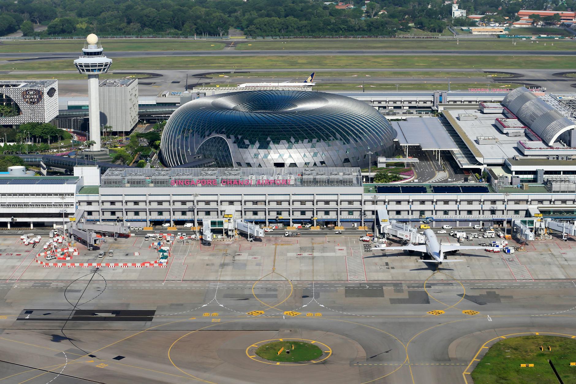 Aerial view of Singapore Changi Airport showing modern terminal architecture and aircraft