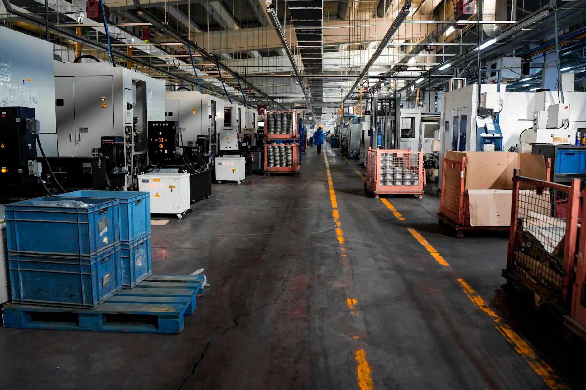 Industrial factory floor with machinery and crates - nearshoring supply chain shifts affecting air freight