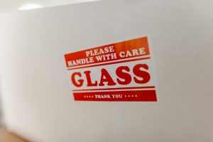 Handle with care warning label on package - IATA dangerous goods regulations for air freight shipping