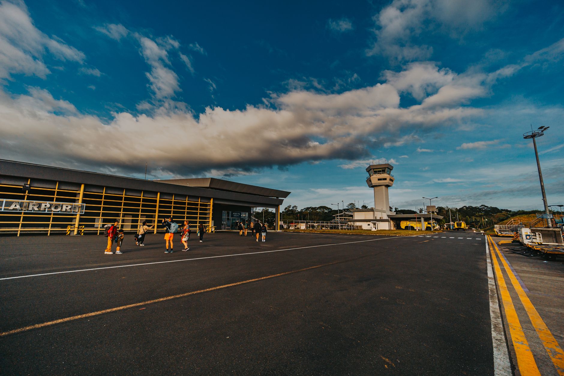 A bustling airport control tower overseeing international cargo terminals.