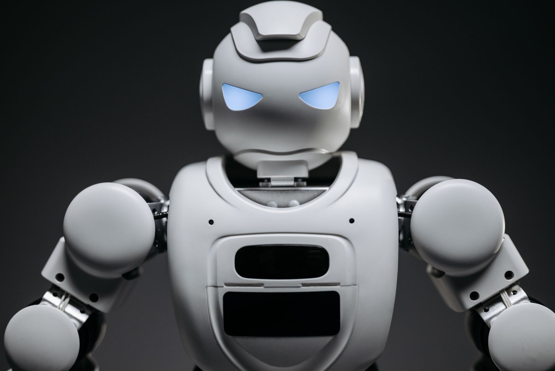 A futuristic robot in a warehouse managing cargo logistics and tracking.