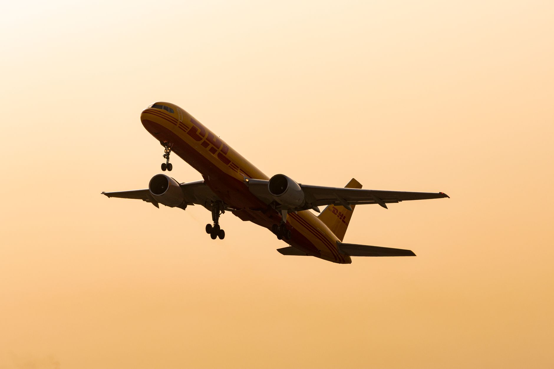 A cargo plane at sunset representing transpacific air cargo.
