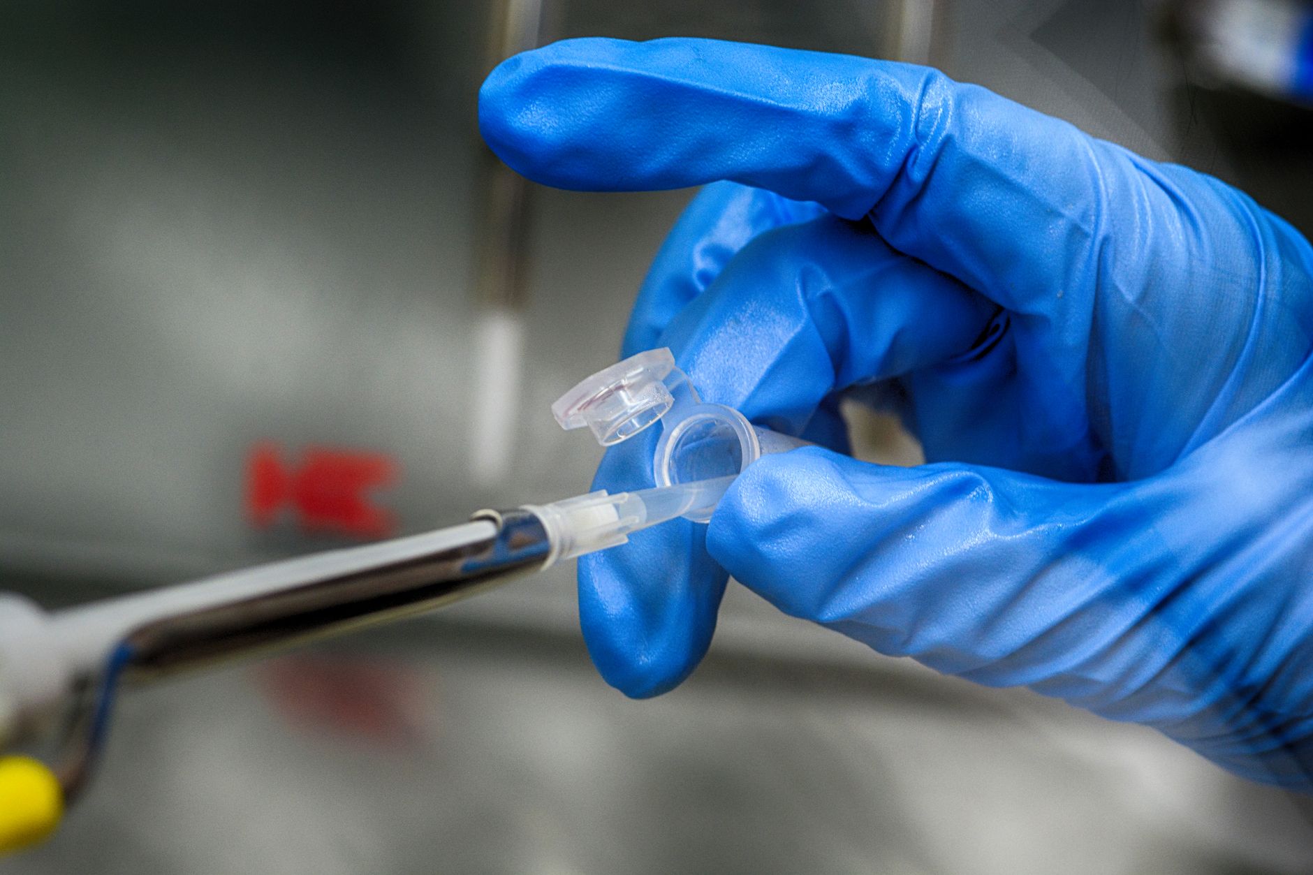 Laboratory setting with pharmaceutical vials and cold chain air freight.